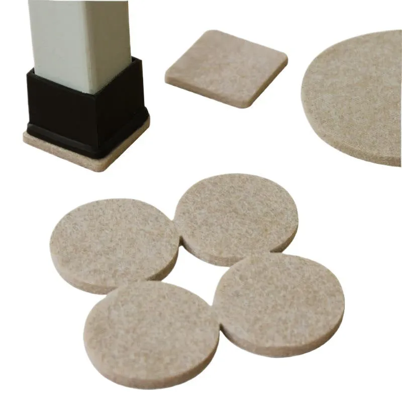 Beige plastic furniture protection foot pads in five different sizes on a wooden floor.
