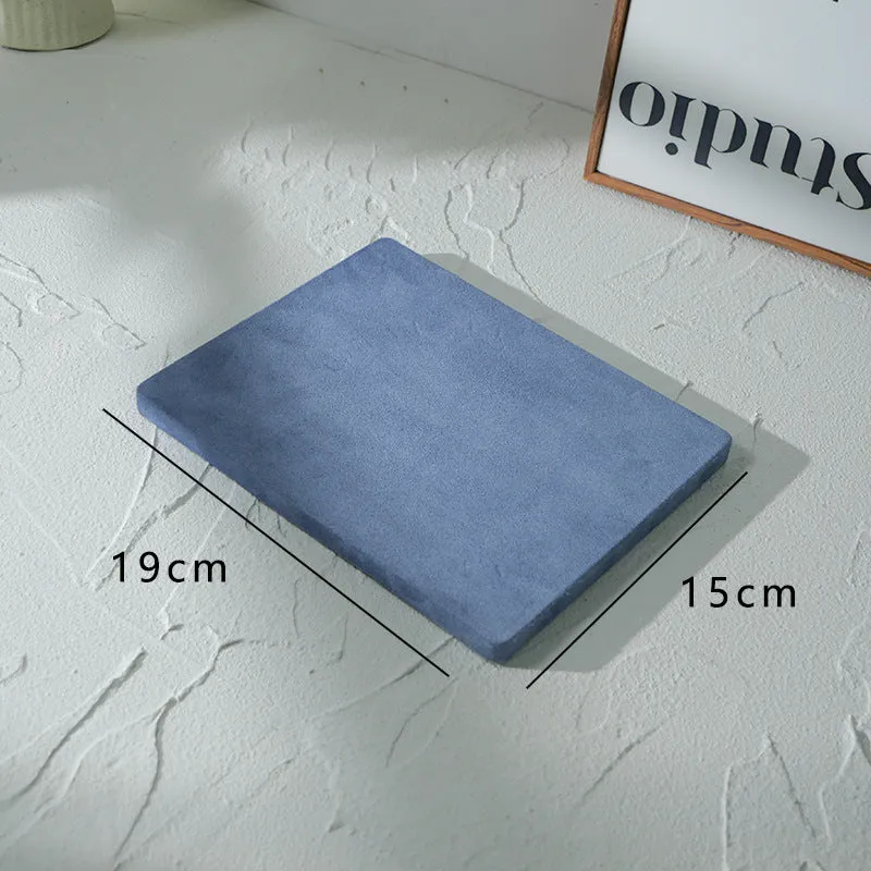 Flannel jewellery display stand in light blue with gypsum base showing 15cm round plate