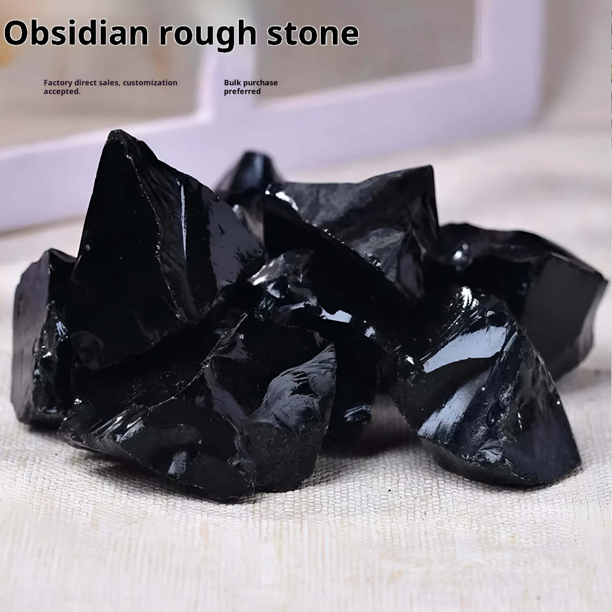 Natural black obsidian rough gravel stones in a pile, size 2-3cm each