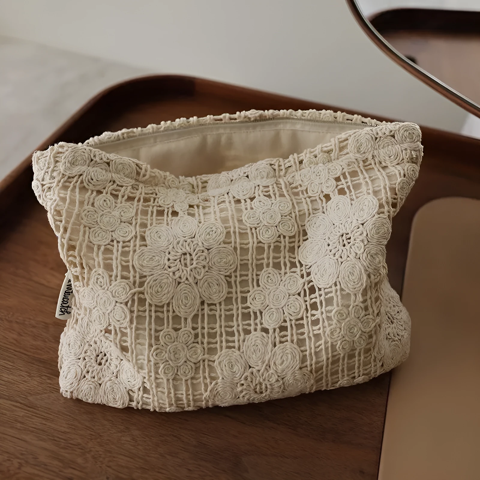 Handmade crocheted hollow flower cosmetic bag with ethnic embroidery patterns on corduroy fabric