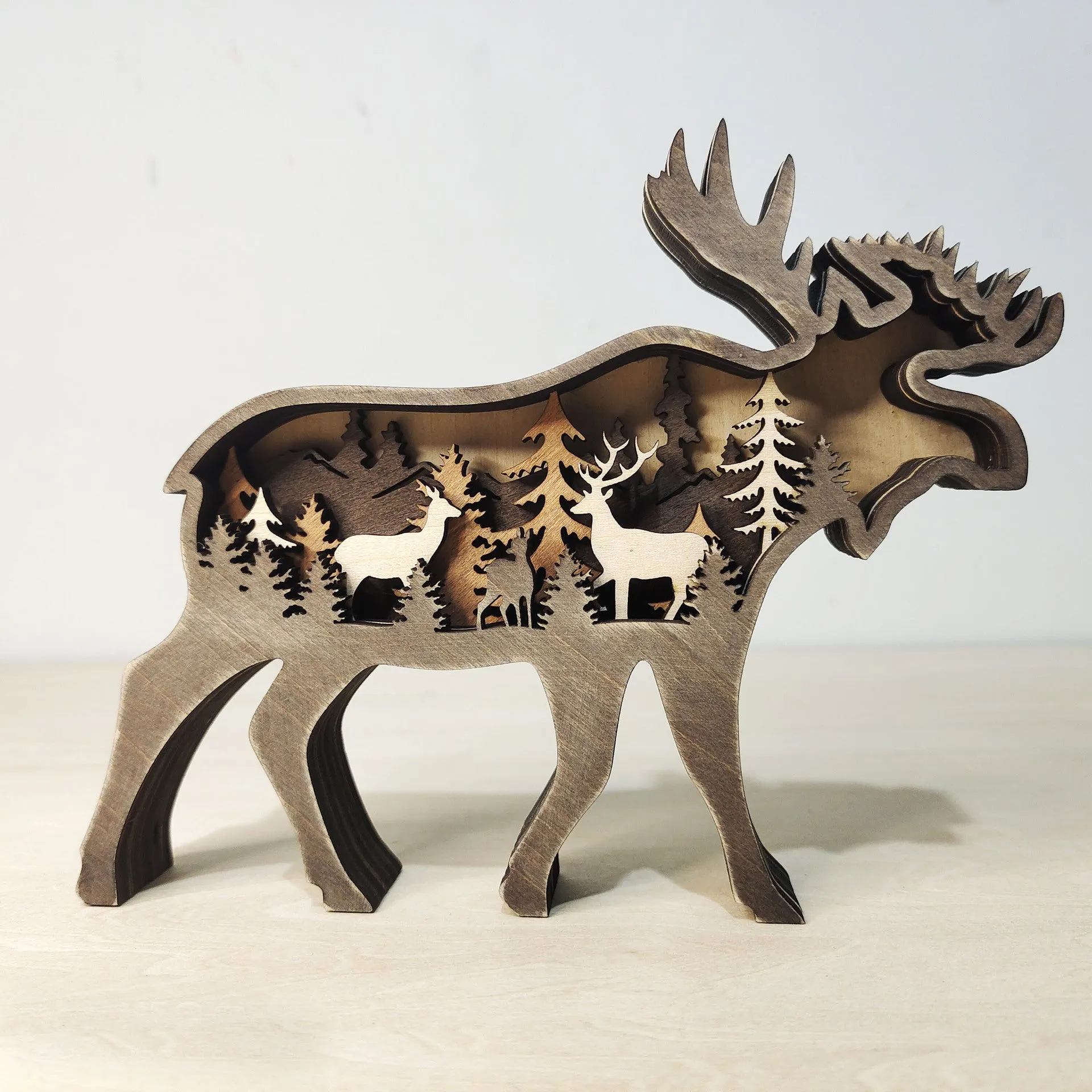 Boxwood elk ornament 18cm tall with antlers, natural wood finish, on a tabletop
