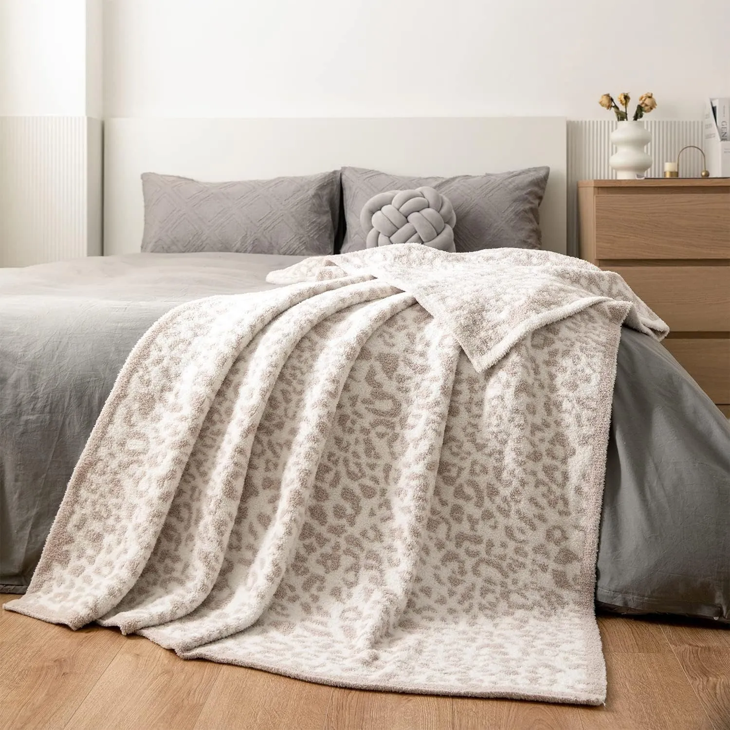 Half velvet leopard print knitted blanket in gray on a sofa, size 130x150cm