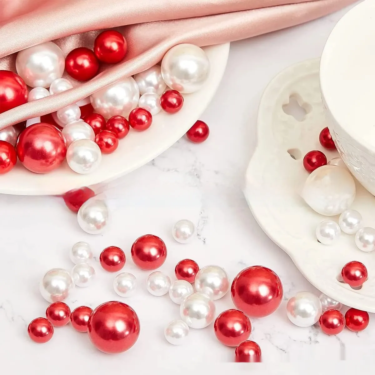 Two red suit floating stuffed vase Christmas decorations with plastic floating filling vase on a table