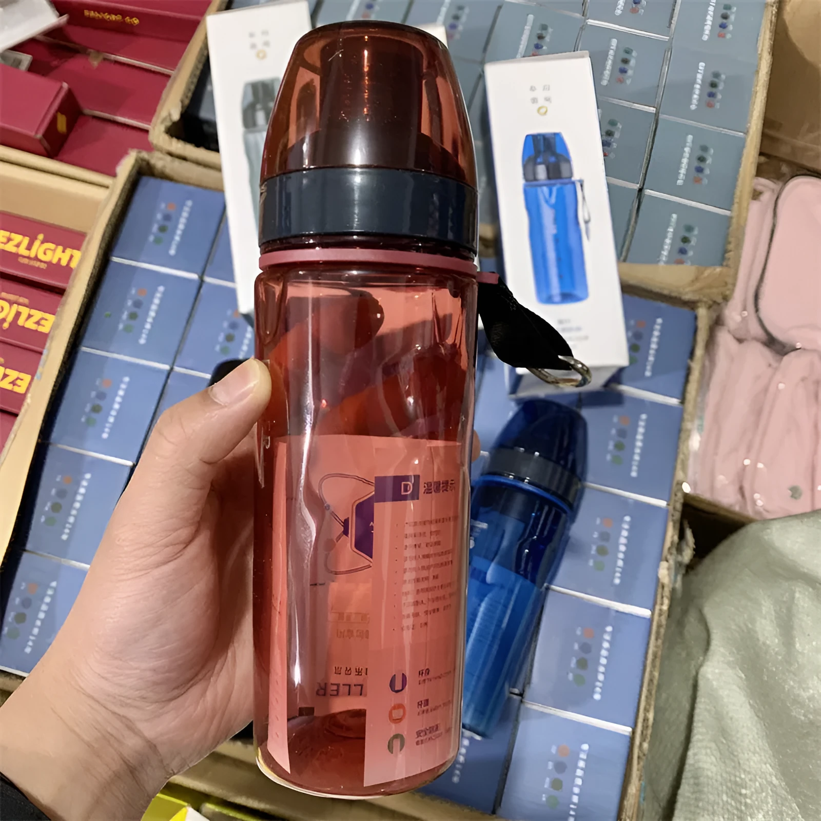 Blue portable sports water bottle with Chinese style design and integrated tea compartment