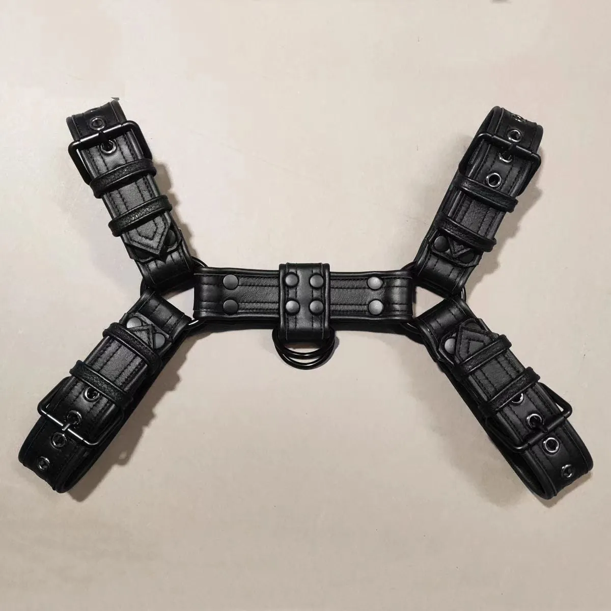 Black leather chest muscle bondage strap with metal buckle fastening system