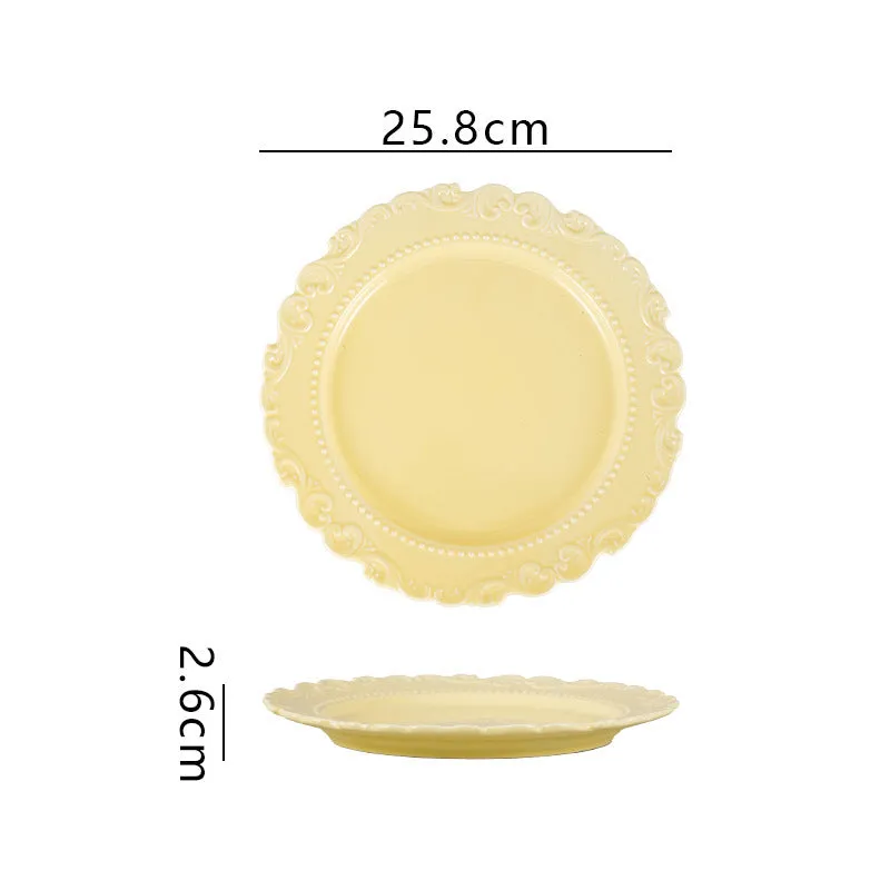Cream ceramic vintage lace plate with irregular shape and glazed finish in white
