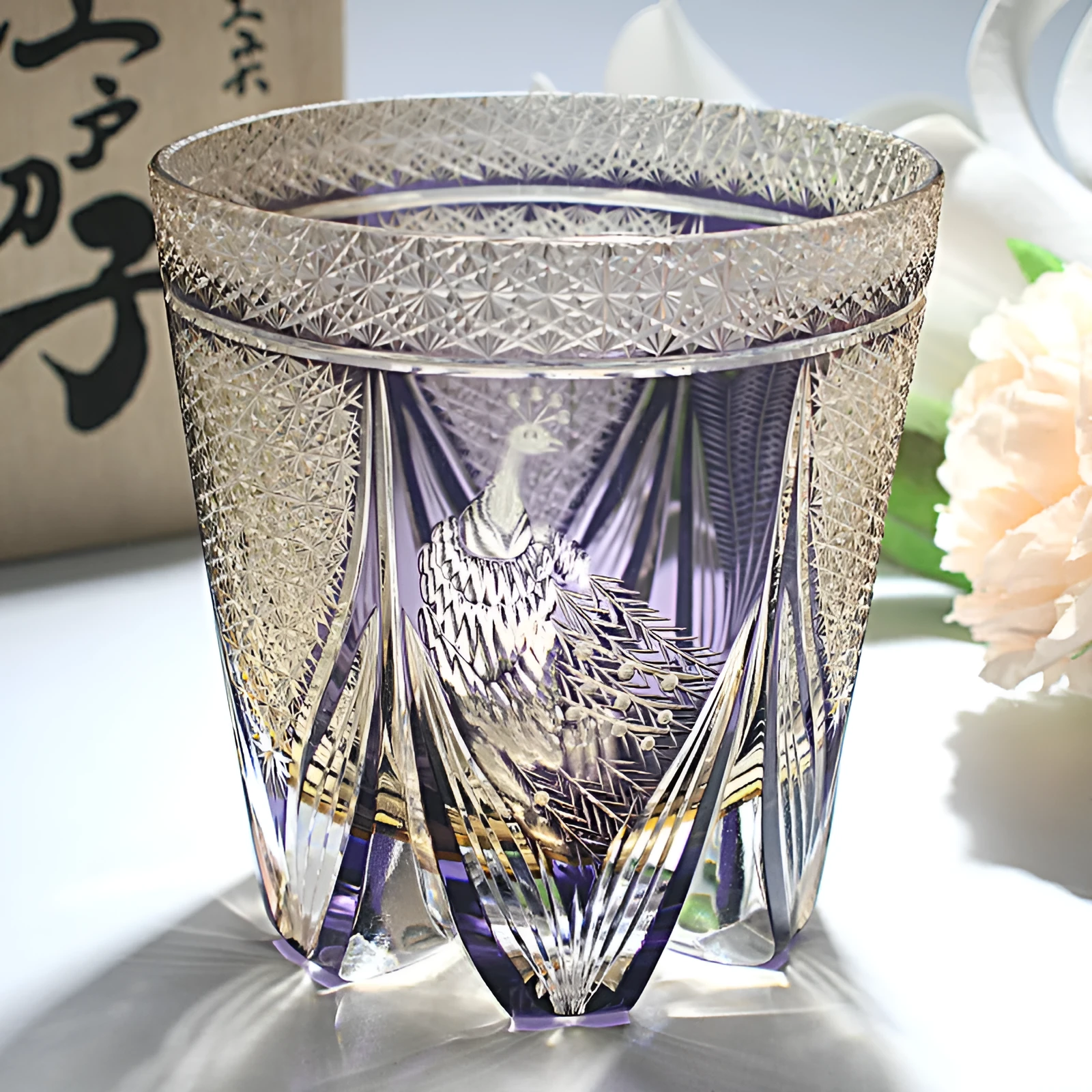 Crystal whiskey glass in simple style, colour Bluish Gray Fluorite, on a table