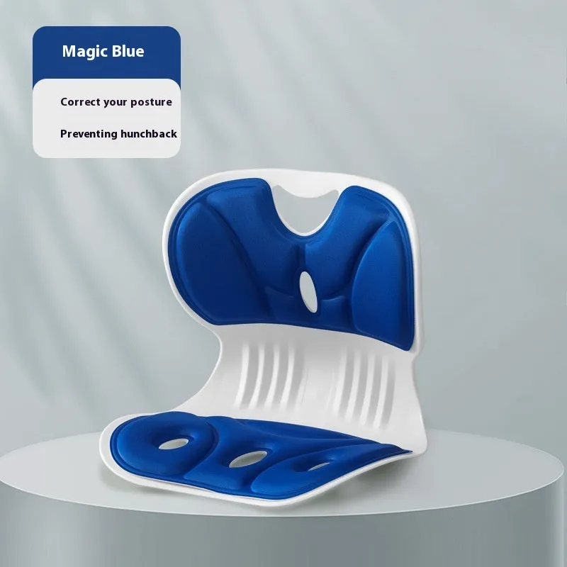 Memory foam chair cushion in grey on a wooden chair, showing lumbar support and minimalist solid colour design.
