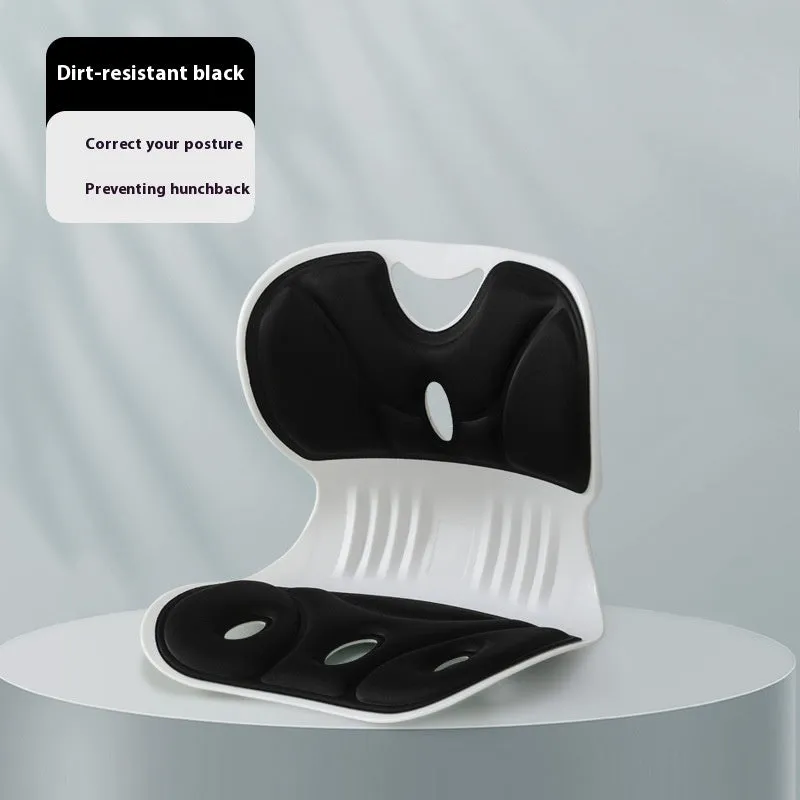 Memory foam chair cushion in grey on a wooden chair, showing lumbar support and minimalist solid colour design.