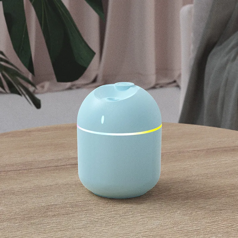 USB desktop humidifier with large spray, mute operation, and colour light in green plastic body