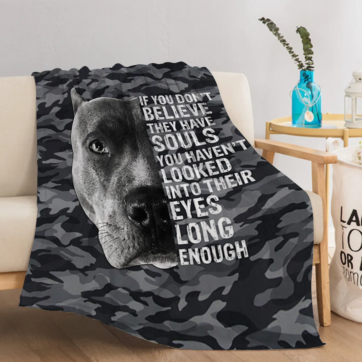 Flannel black background dog pet theme soft printed blanket folded on a sofa
