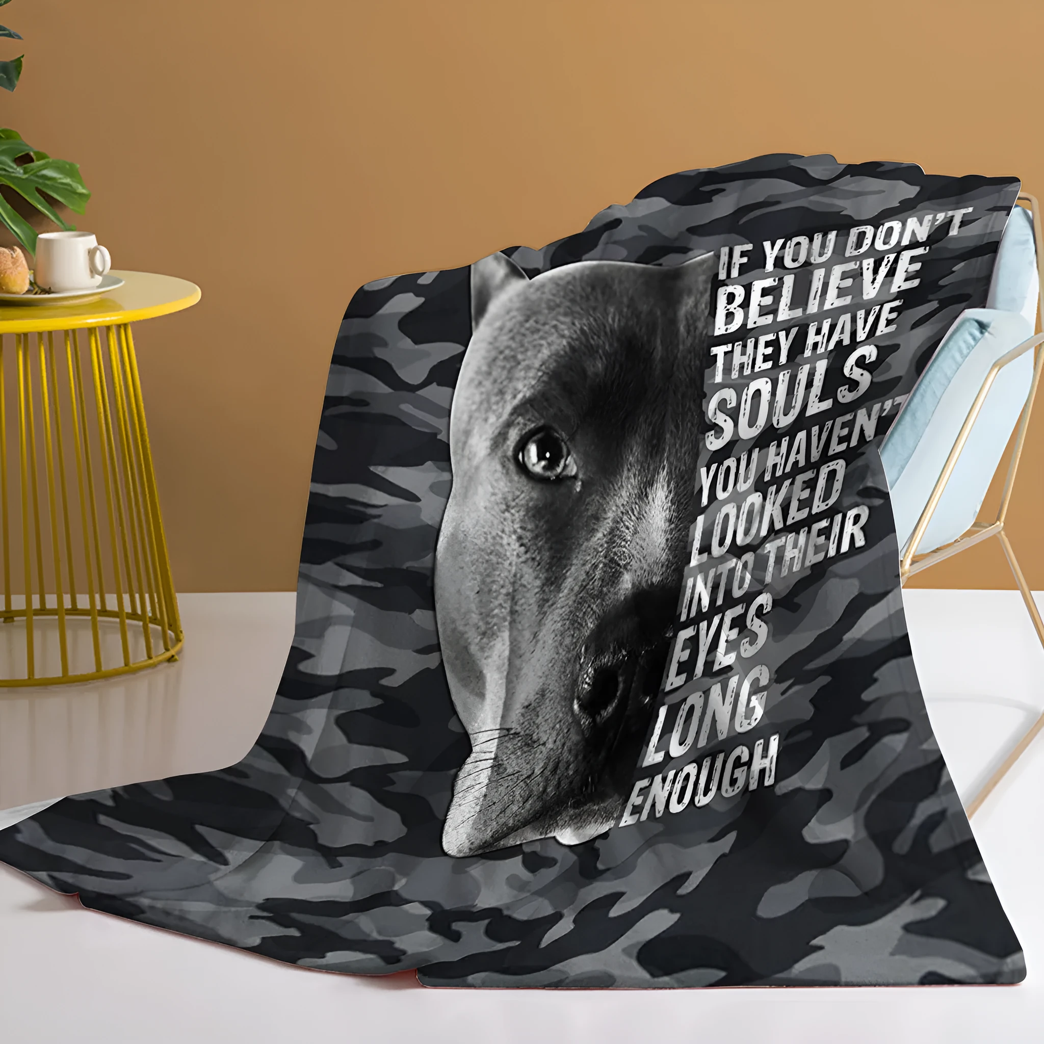 Flannel black background dog pet theme soft printed blanket folded on a sofa