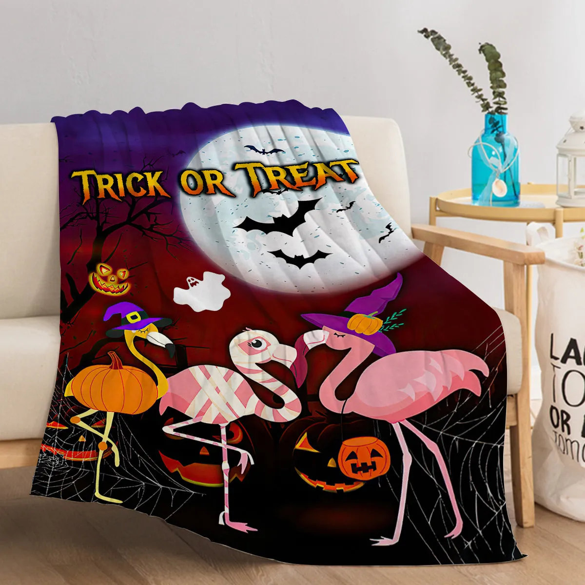Purple flannel throw blanket with Halloween flamingo print, soft velvet texture, hemmed edges, available in multiple sizes