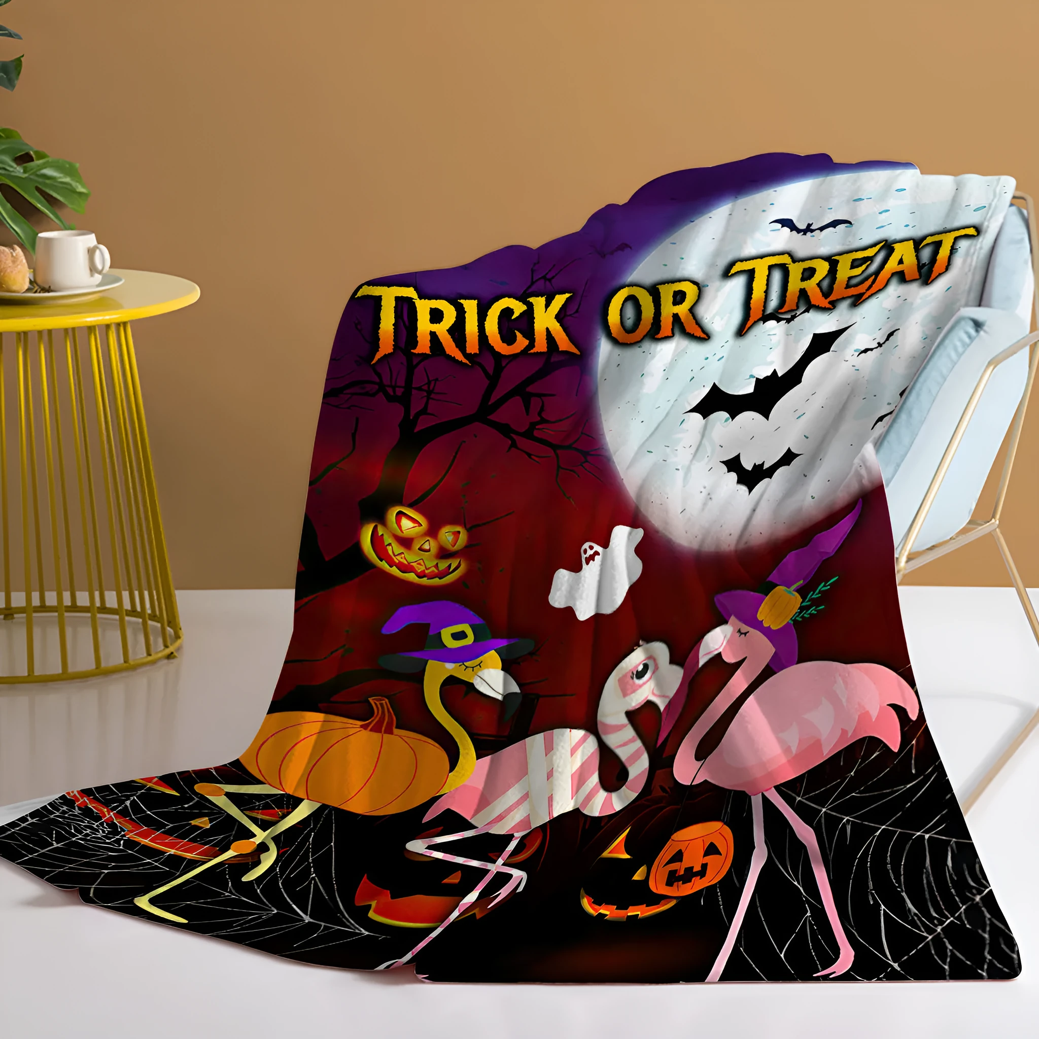 Purple flannel throw blanket with Halloween flamingo print, soft velvet texture, hemmed edges, available in multiple sizes