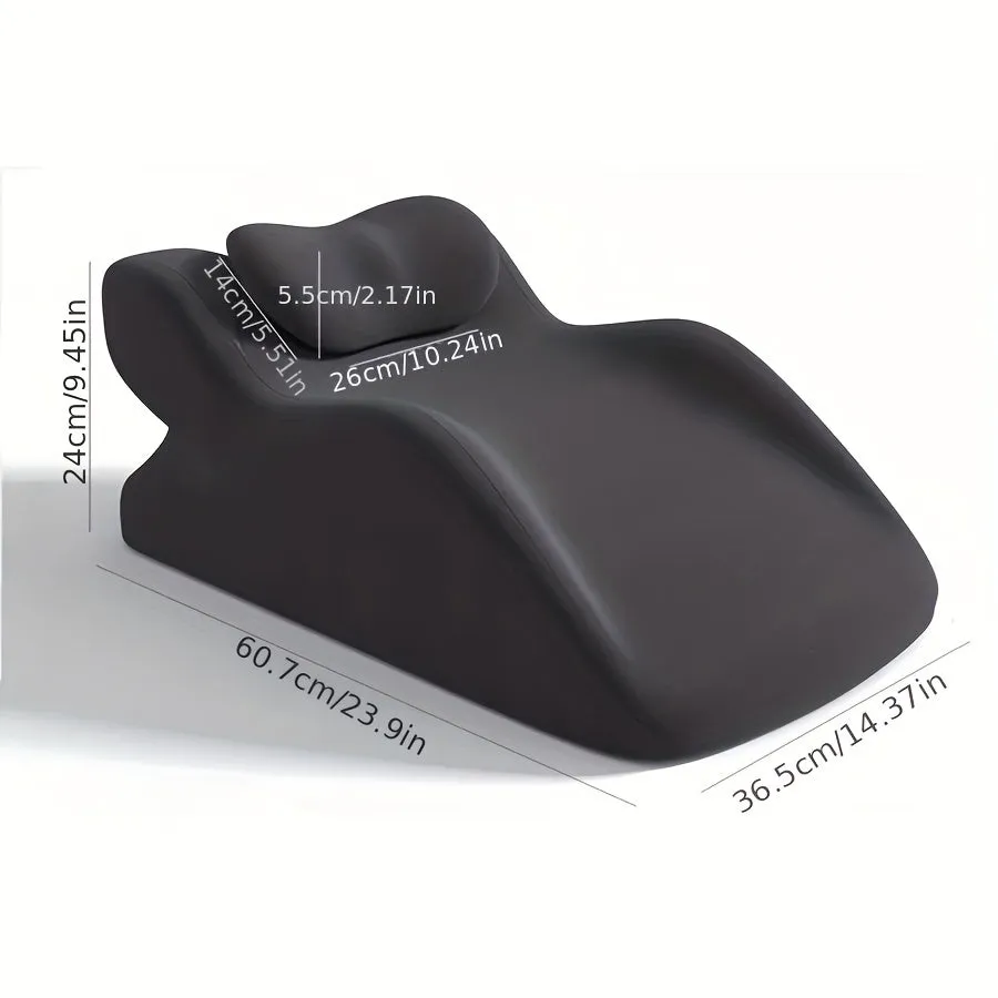 A prone position stomach sleeping pillow shown in a light grey colour, designed for use while reading in bed.