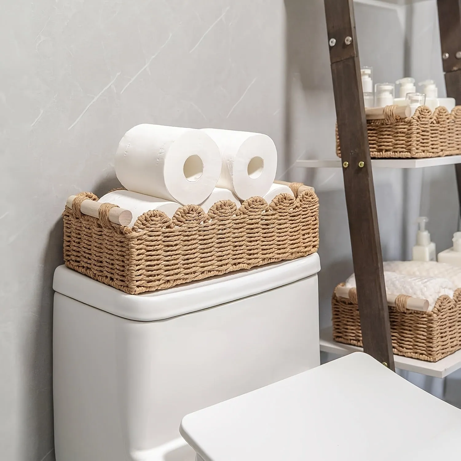 Rectangular woven paper storage basket in a neutral colour on a wooden tabletop.