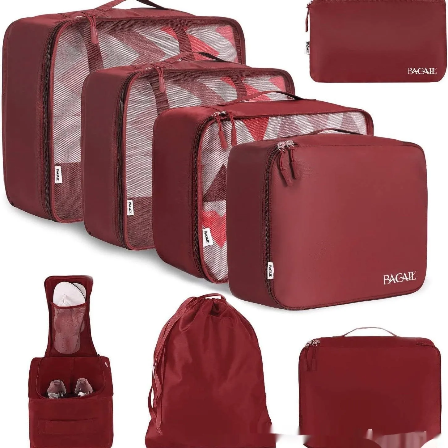 Set of eight cubic packing organisers in assorted solid colours including beige, black, and pink.
