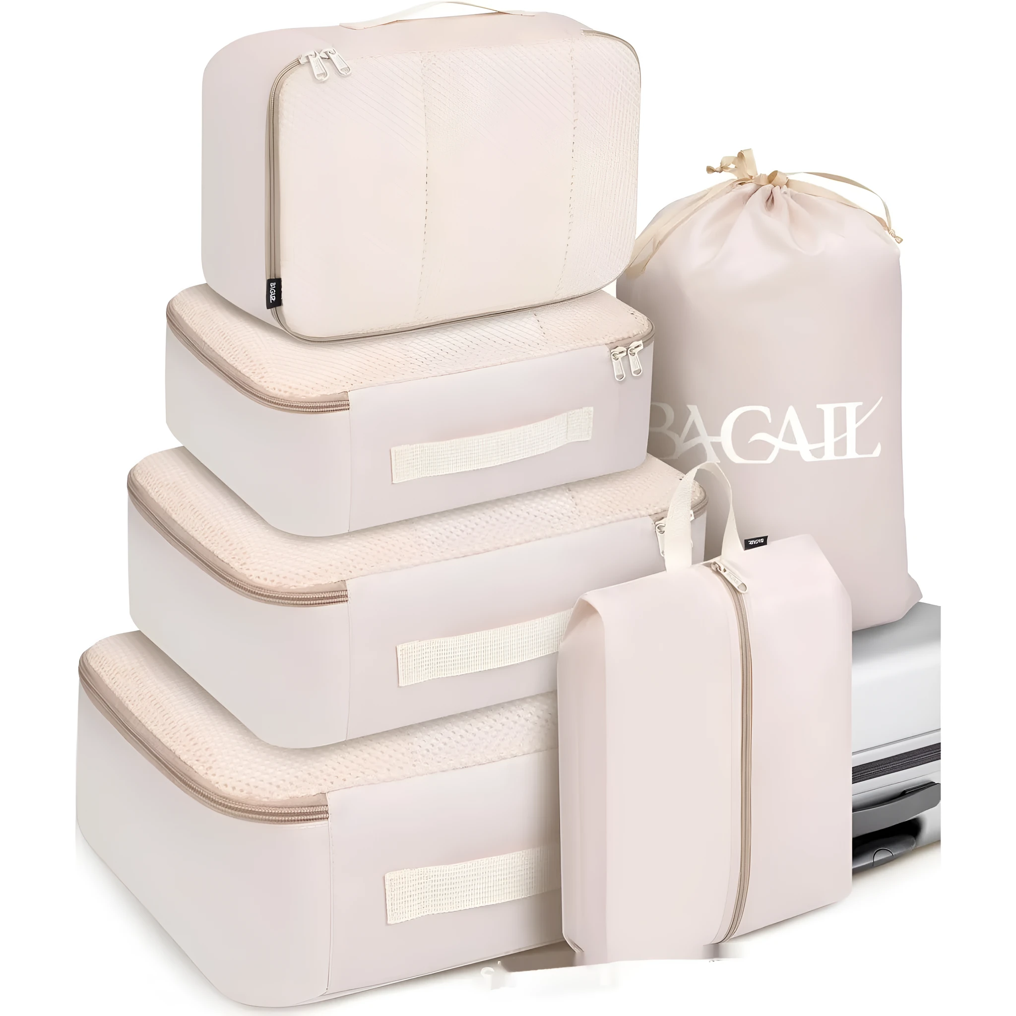 Set of eight cubic packing organisers in assorted solid colours including beige, black, and pink.