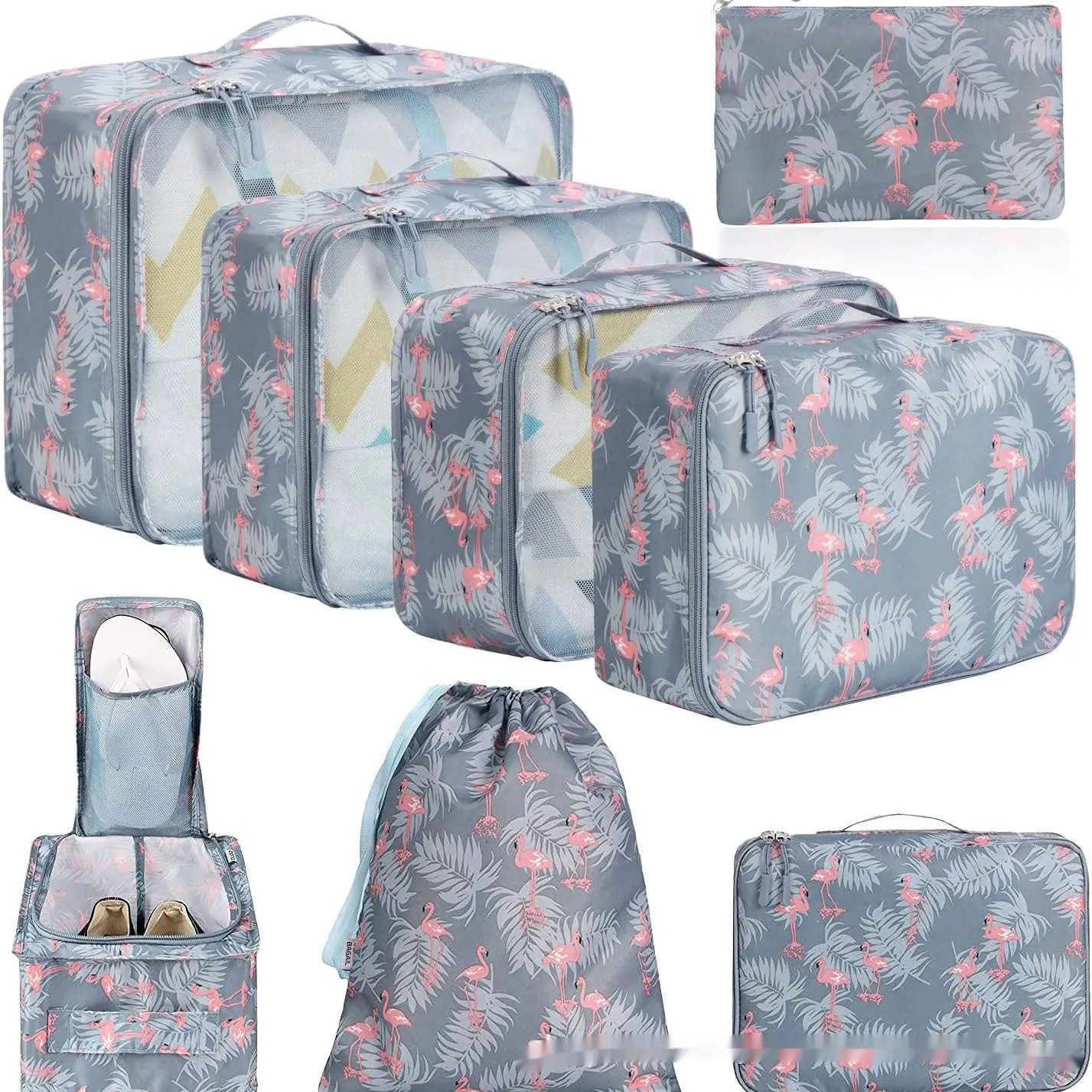 Set of eight cubic packing organisers in assorted solid colours including beige, black, and pink.