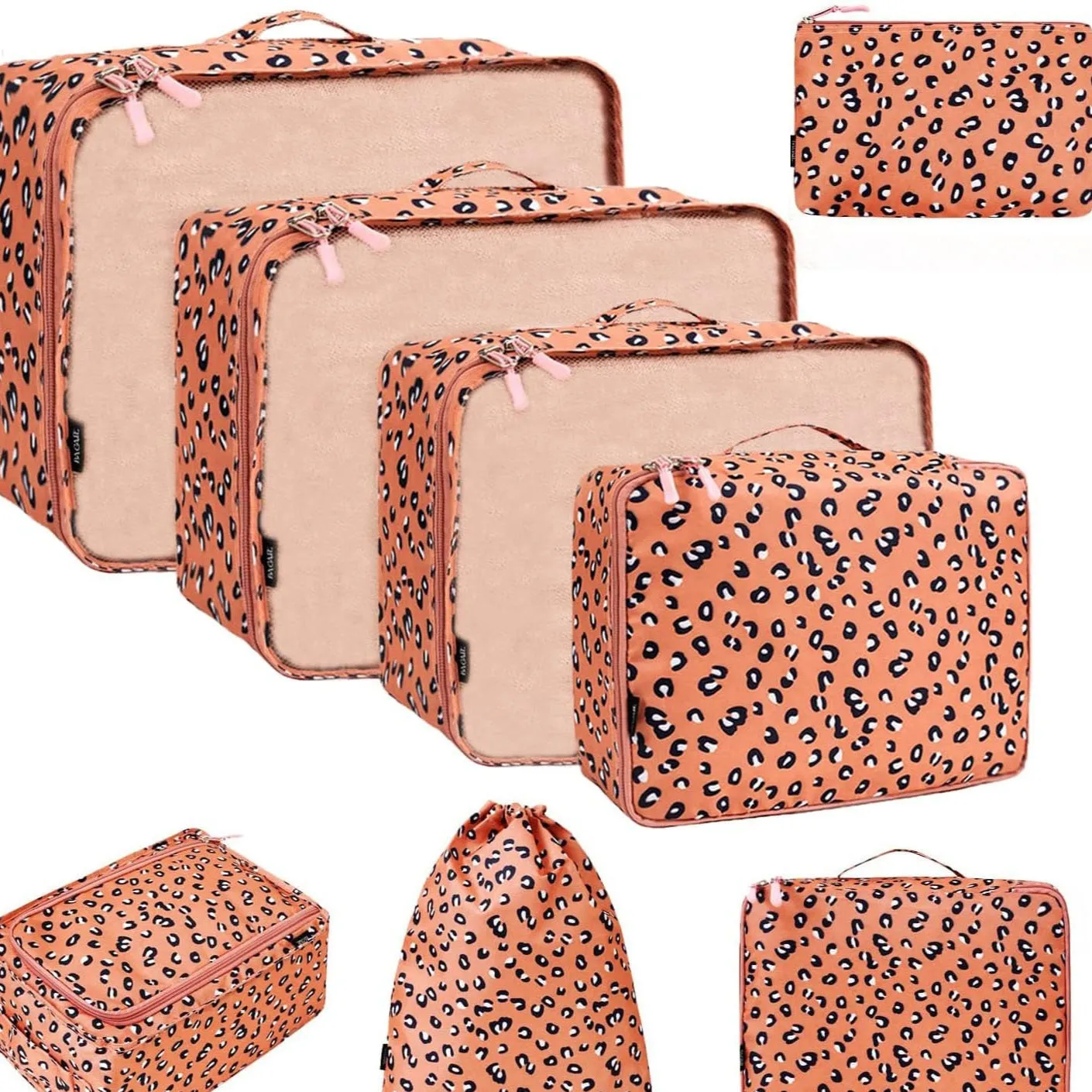 Set of eight cubic packing organisers in assorted solid colours including beige, black, and pink.