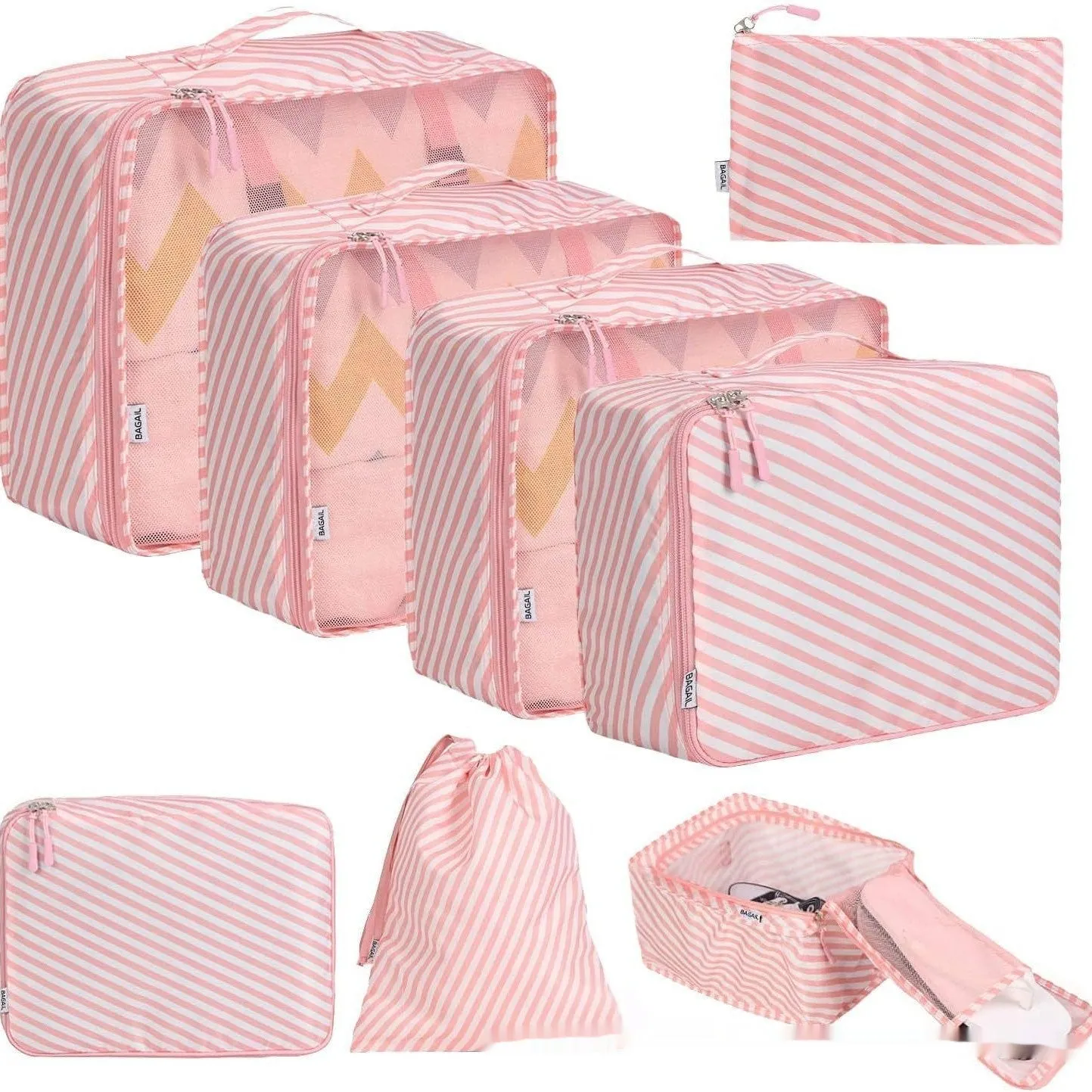Set of eight cubic packing organisers in assorted solid colours including beige, black, and pink.