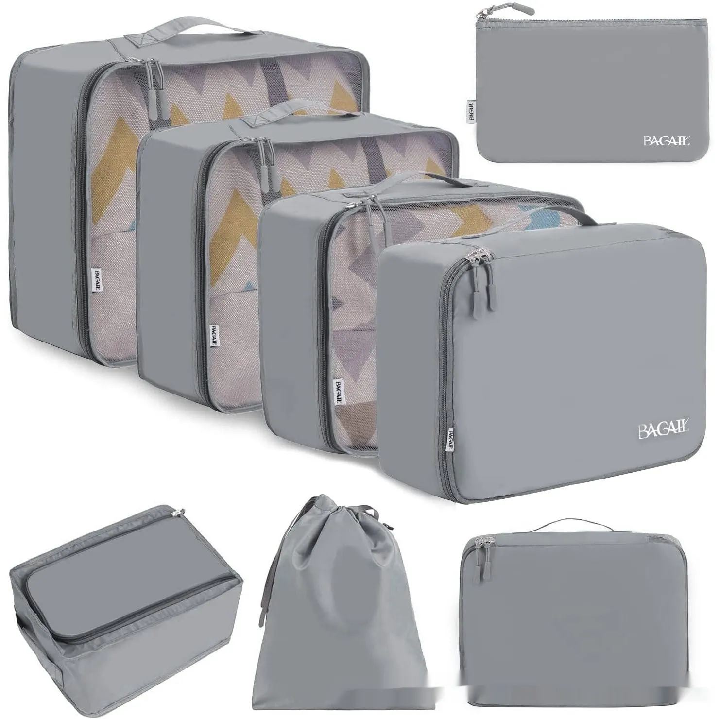 Set of eight cubic packing organisers in assorted solid colours including beige, black, and pink.