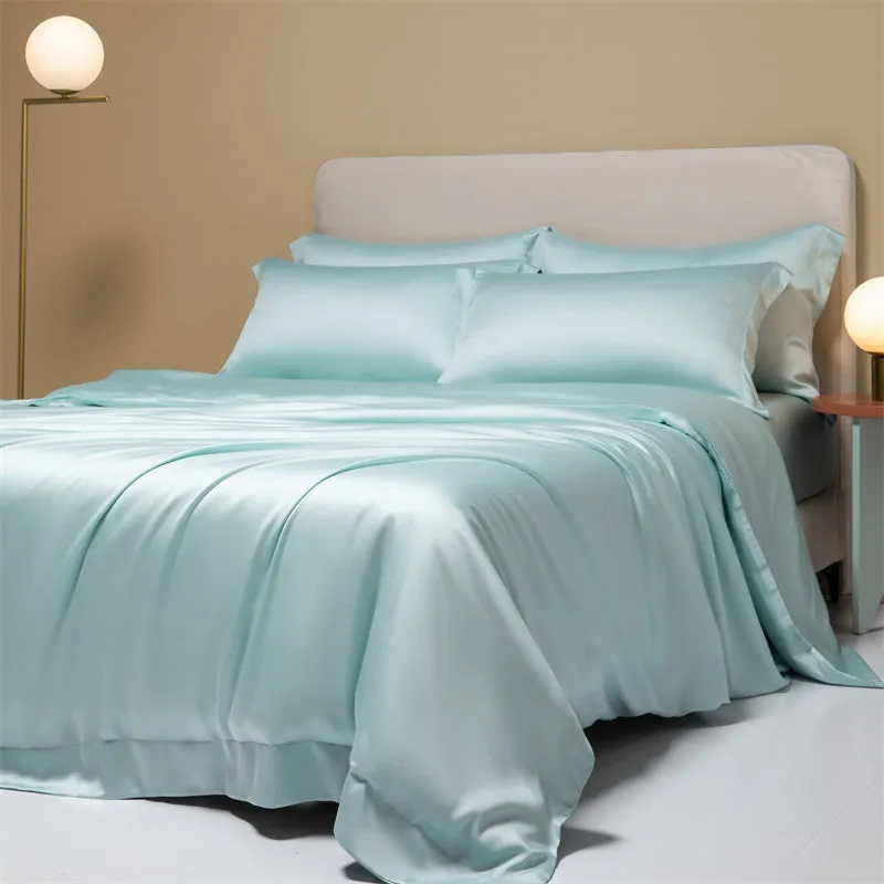Luxury Lenzing Tencel duvet cover and pillowcase set in Aurora Blue colour on a modern bed.