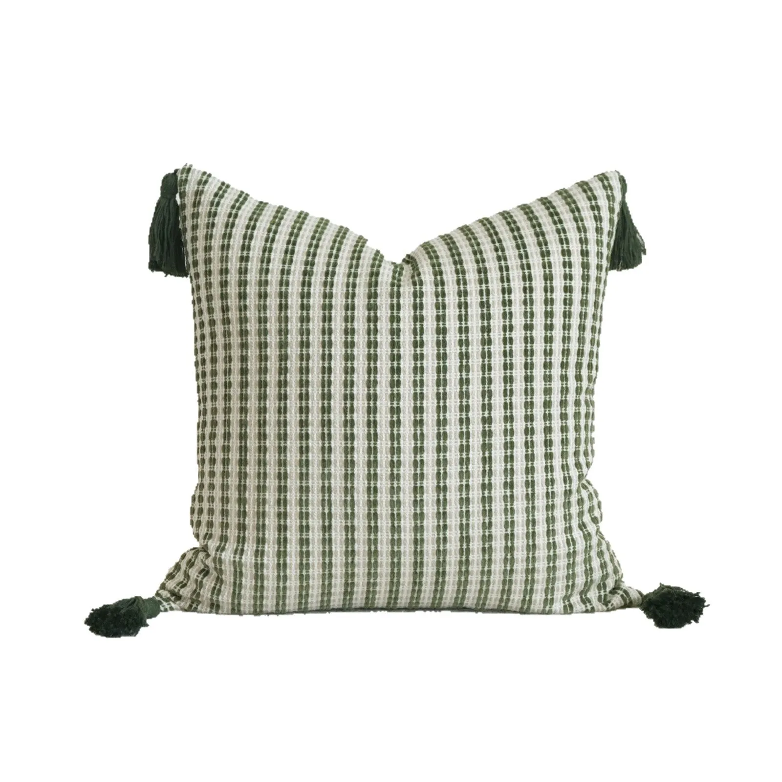 Green cotton and linen hotel sample pillow with botanical pattern and tassel detail on a display bed.