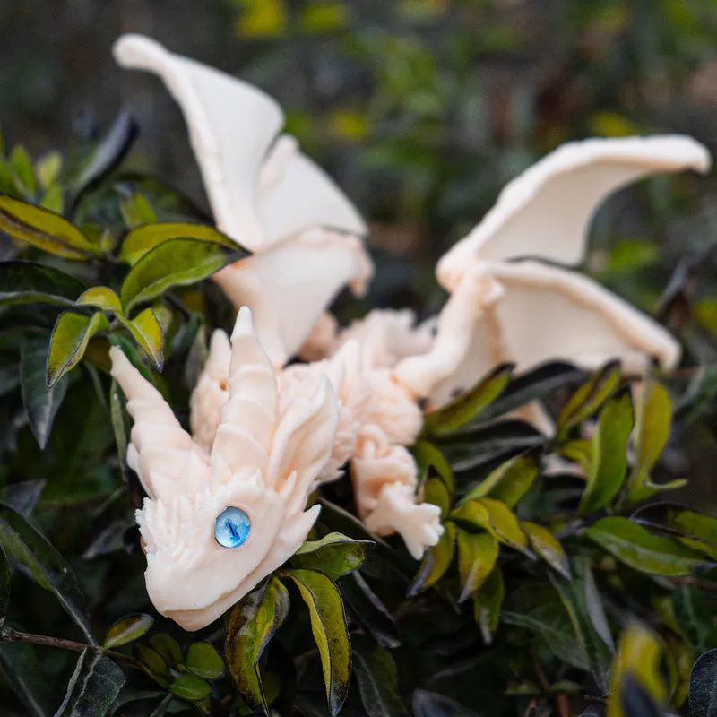 Red and gold PLA flying dragon wings decoration toy measuring 25cm wide.