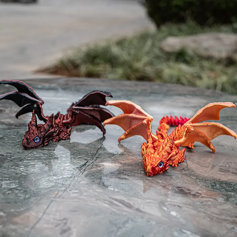 Red and gold PLA flying dragon wings decoration toy measuring 25cm wide.