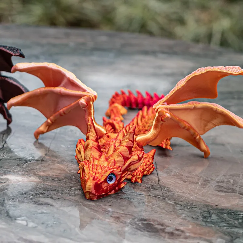 Red and gold PLA flying dragon wings decoration toy measuring 25cm wide.