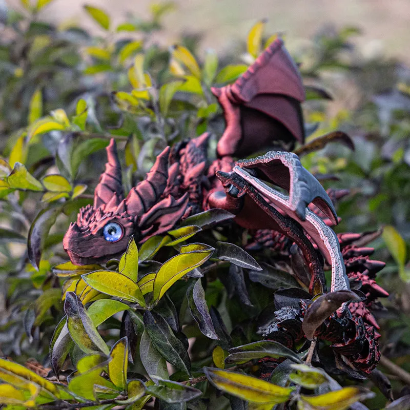 Red and gold PLA flying dragon wings decoration toy measuring 25cm wide.