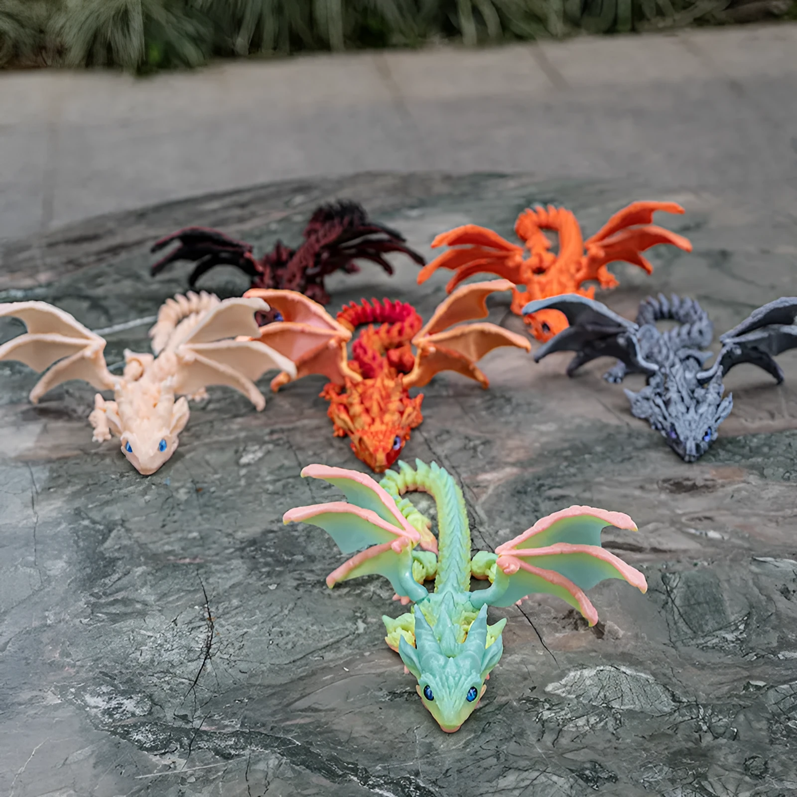 Red and gold PLA flying dragon wings decoration toy measuring 25cm wide.