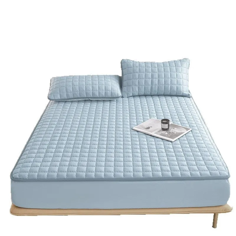 Blue waterproof fitted sheet with elasticated corners on a mattress.