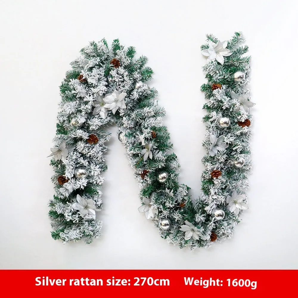American-style red flocked PVC rattan Christmas garland decoration draped over a mantelpiece.