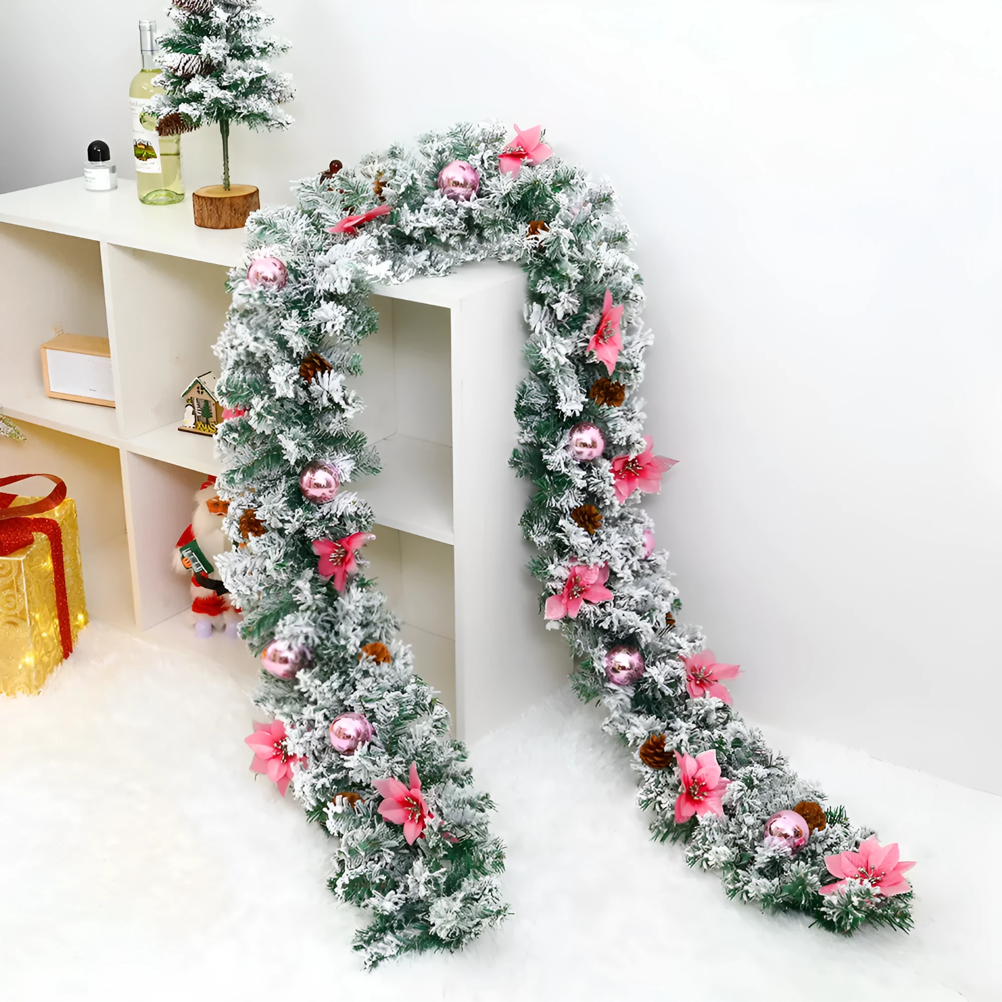 American-style red flocked PVC rattan Christmas garland decoration draped over a mantelpiece.