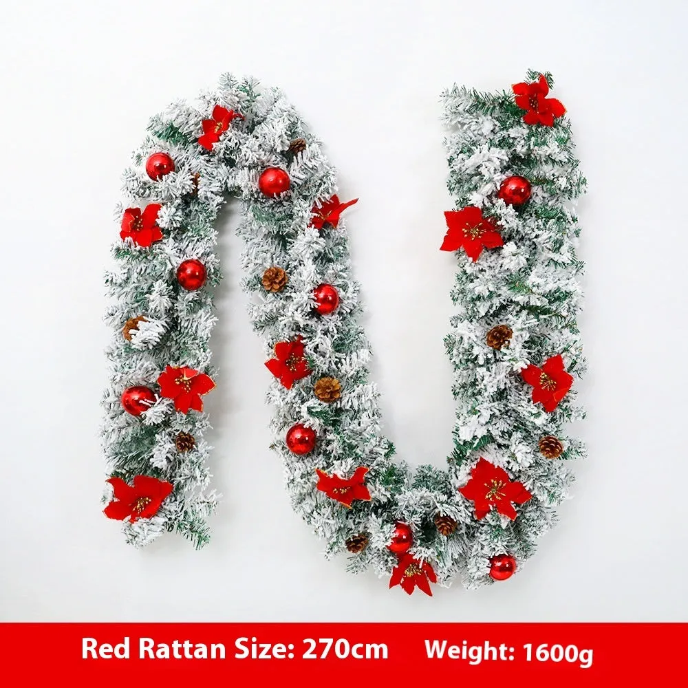 American-style red flocked PVC rattan Christmas garland decoration draped over a mantelpiece.