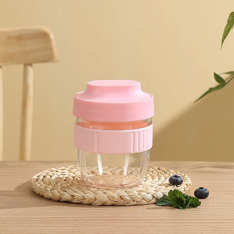 Green plastic salad cup with clear lid and integrated spoon showing 480ml capacity measurement