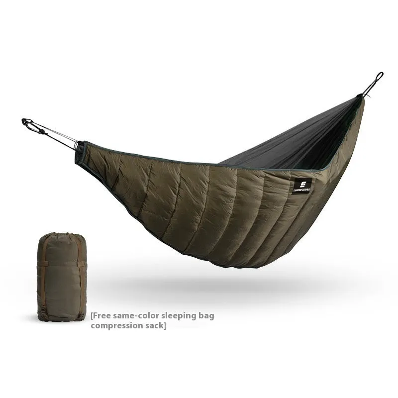 Army green thickened camping hammock sleeping bag with compression bag, shown in an outdoor setting.