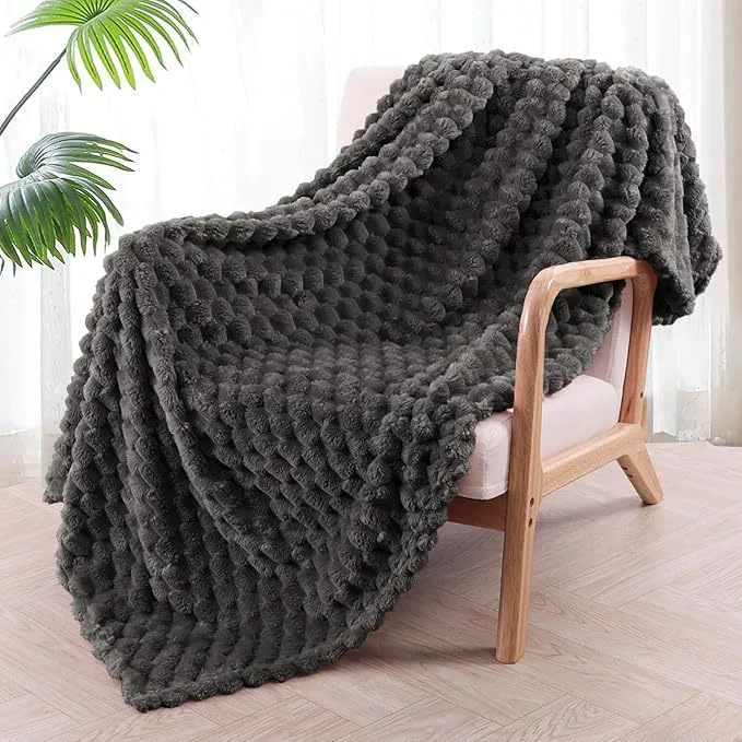 Children's soft plaid polyester blanket shown in camel colour, suitable for nap time.