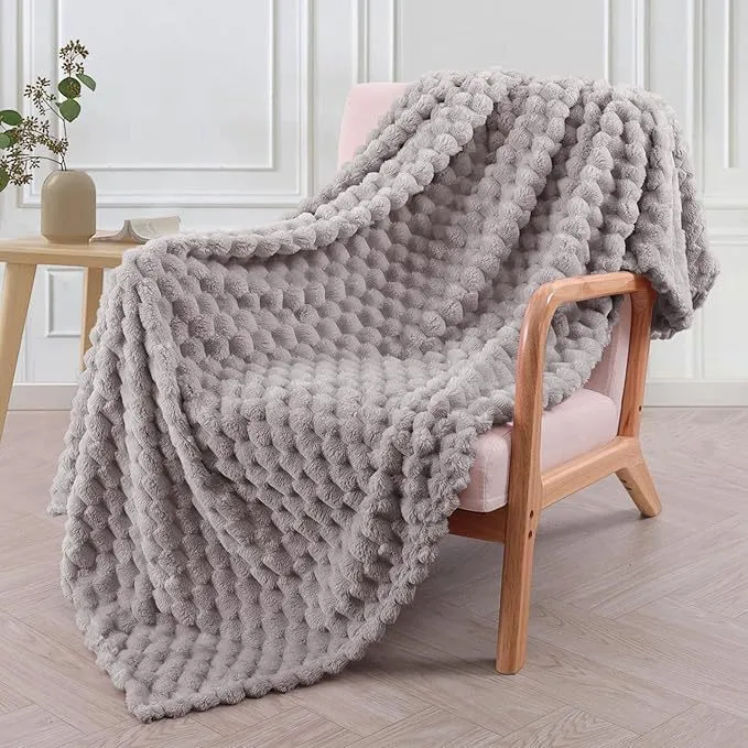 Children's soft plaid polyester blanket shown in camel colour, suitable for nap time.