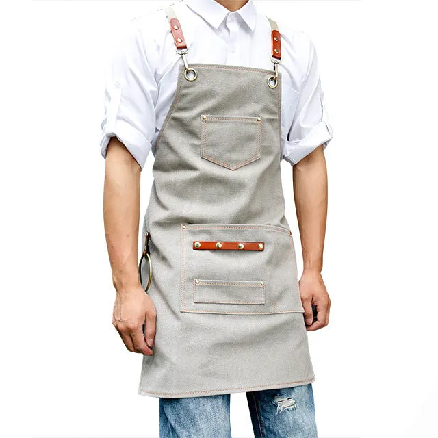 Canvas apron with cross-strap design in camel colour for café work and baking