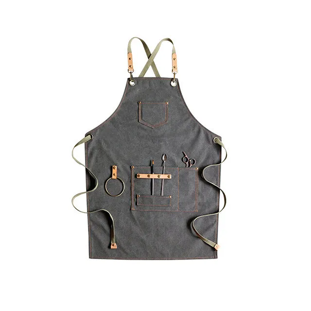Canvas apron with cross-strap design in camel colour for café work and baking