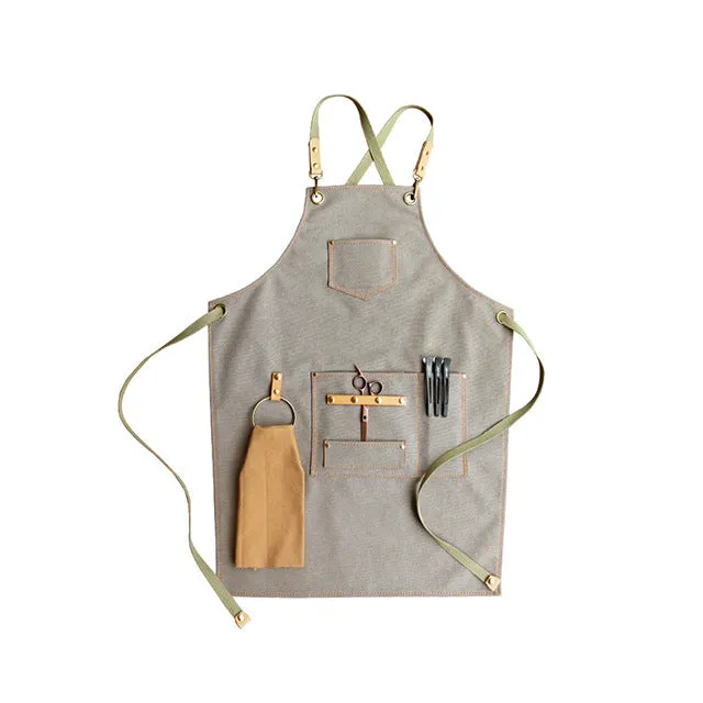 Canvas apron with cross-strap design in camel colour for café work and baking