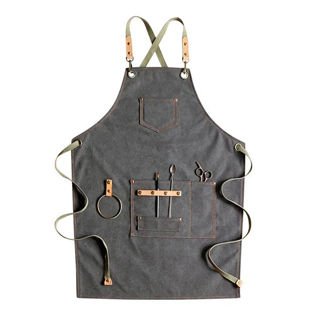 Canvas apron with cross-strap design in camel colour for café work and baking