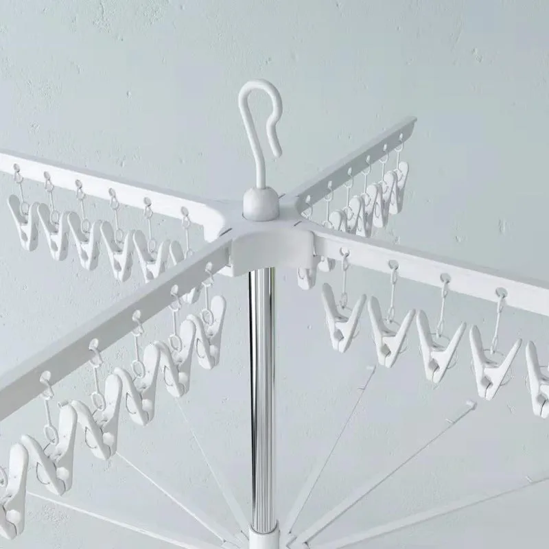 Three-layer stainless steel clothes drying rack with plastic clips for socks, ties, and trousers organisation