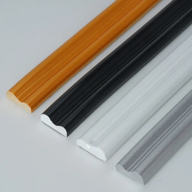Flexible white PVC self-adhesive edge banding strip for wall shaping and backdrop borders.