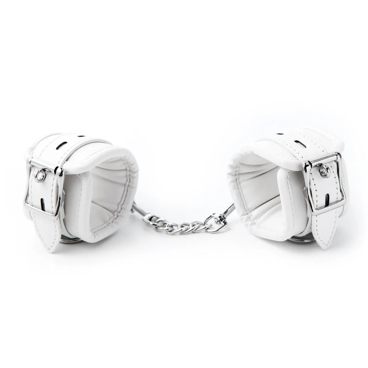White PU sponge bondage set showing soft handcuffs, ankle cuffs, and a neck scarf laid out.