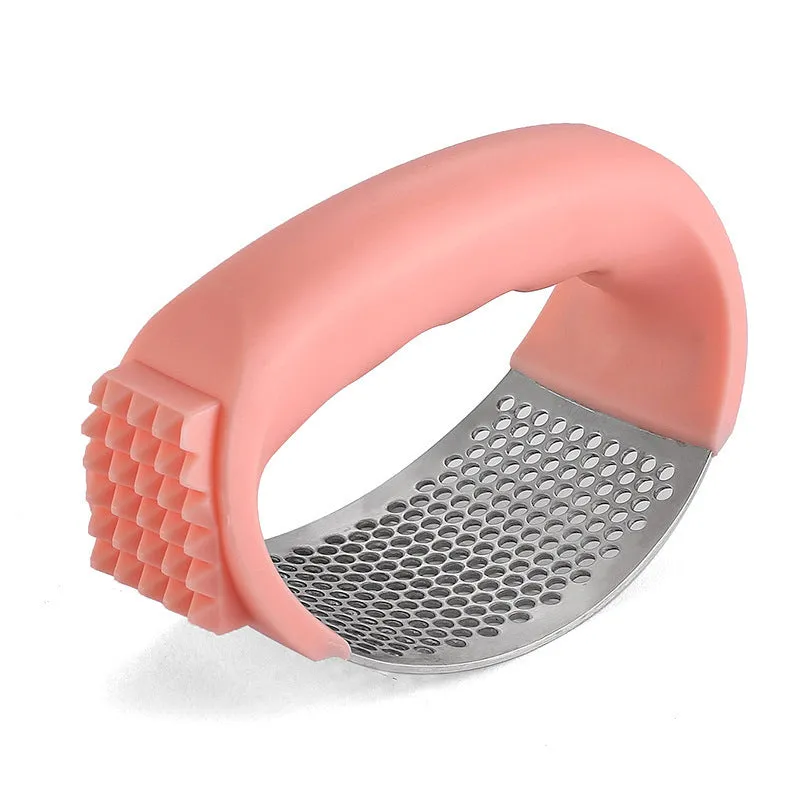 304 stainless steel garlic press in green, pink, black or blue measuring 11cm by 7cm
