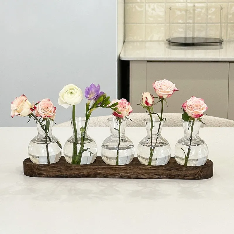 Transparent hydroponic vase on wooden frame in modern design